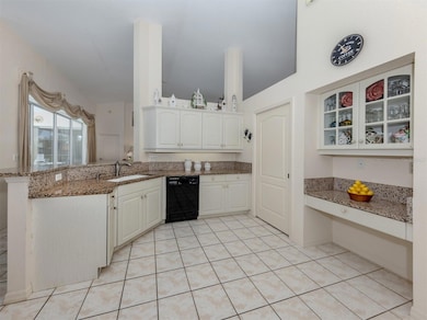 The breakfast bar overlooks the dinette space and includes a desk so the chef and look up the recipe for those special planned meals