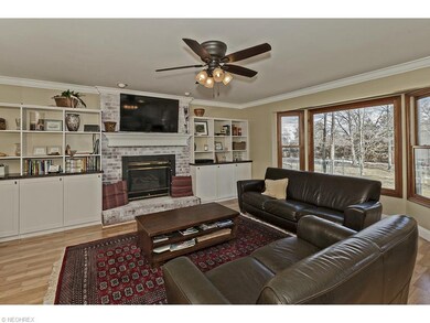 Custom shelving and a brick fireplace is the focal