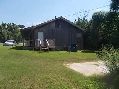 Exterior Back. Back of house has small deck to ins