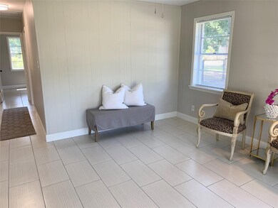 Sitting room with light tile patterned floors