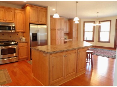 This spacious kitchen with custom cabinets, stainl