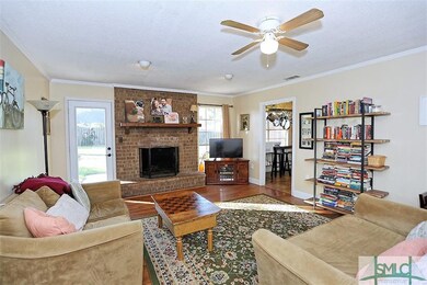 LOVELY FAMILY ROOM WITH BRICK FIREPLACE....DOOR TO