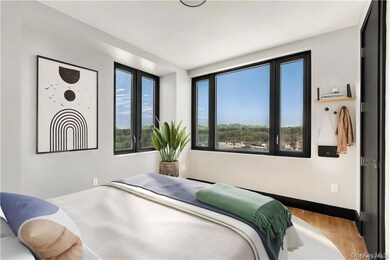 Bedroom featuring baseboards and wood finished floors