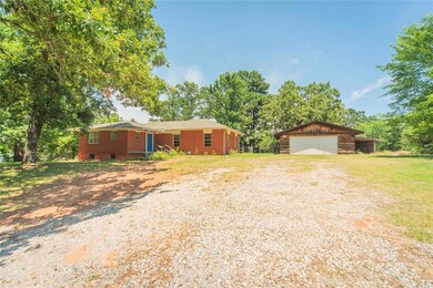 Ranch-style house with an outdoor structure and a 