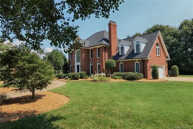 FRONT EXTERIOR WITH ATTACHED TWO-CAR GARAGE AND CI