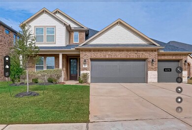 Front porch and 3 car garage.  Lot placement adds privacy on side and back