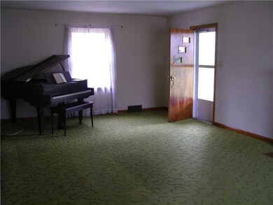 Living Room. Open door leads to the covered side p