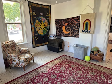 Living area with tile patterned flooring and plenty of natural light