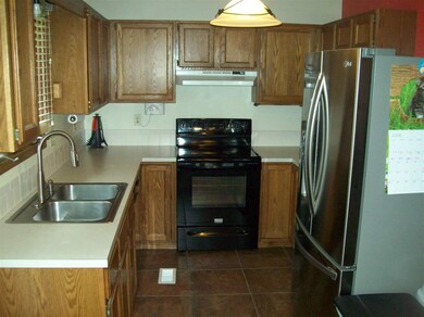 OAK STAIN CABINETS, TILE BACKSPLASH, BUILT-IN MICR