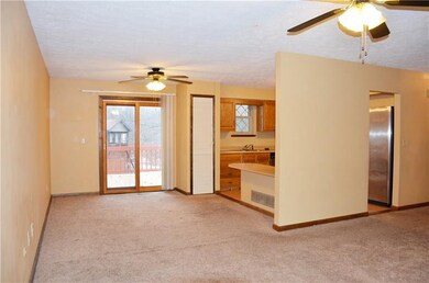 Living room open to the dining room with a slider 