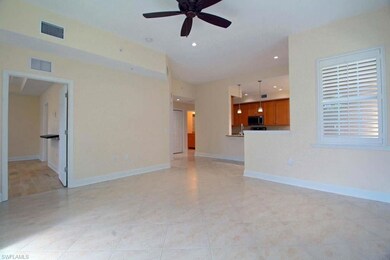 Unfurnished living room with ceiling fan
