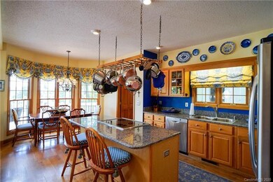 Kitchen and breakfast nook featuring blue eyed granite