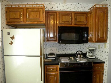 Kitchen. Kitchen contains a ceiling fan with light