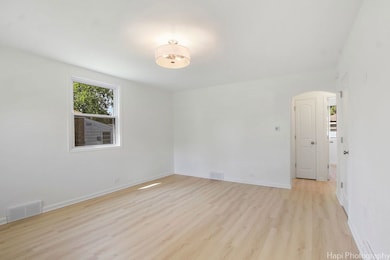 A pristine space with light vinyl plank floors and