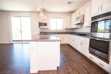 Wide open kitchen/living room with balcony