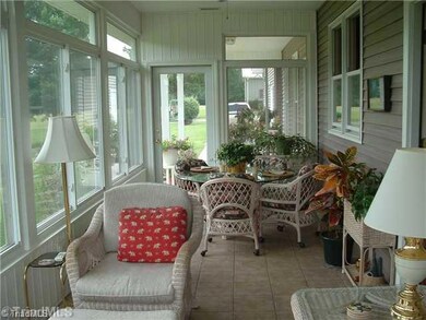Sunroom. This beautiful  27X9 sunroom offers a magnificient view of the lay of the land. The rose garden and the landscaping will take your breath.
