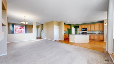 Great room flows seamlessly into the eat in kitchen and back deck.
