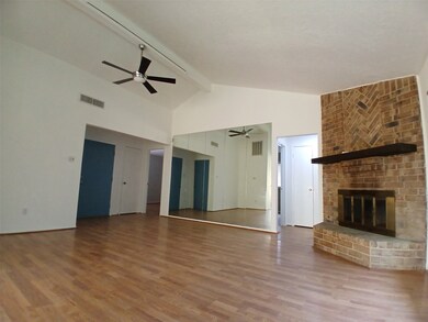 Living boasts vaulted ceilings and a gas log firep