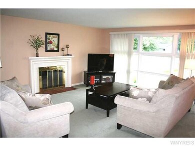 Living Room Wood burning fireplace accents the liv