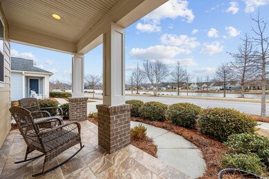 View of patio / terrace featuring a porch, a water
