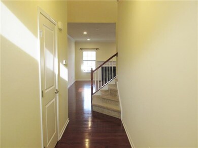 Entry off of ground level.  With gleaming hard woo