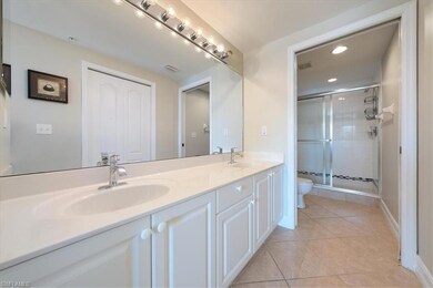 Bathroom with tile patterned flooring, vanity, a s