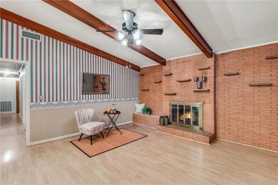 Hearth room off kitchen with wood burning fireplac