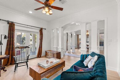 The formal living space also has French doors with