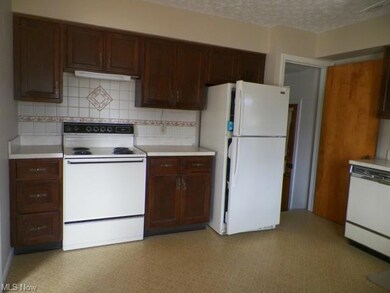 Kitchen. Door leads to garage and basement.