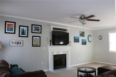 Family Room with crown molding and fireplace