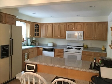 Kitchen: Oak cabinets with new counter tops, sink,