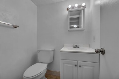 Bathroom located in bedroom offers a tub/shower co