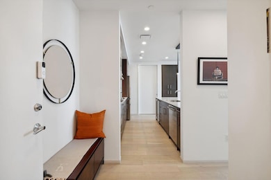 Corridor with a sink, recessed lighting, light wo