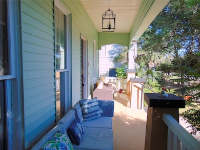 Enjoy the sea breezes on the front porch before you walk to The Spot and Gaidos on the Seawall.