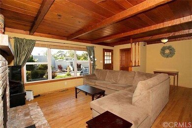 Living room features solid hardwood floors, wood b
