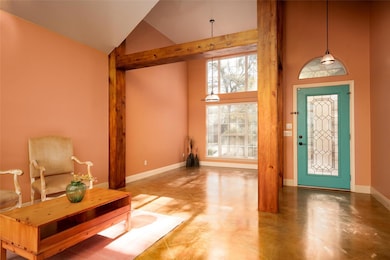 Foyer with high vaulted ceiling