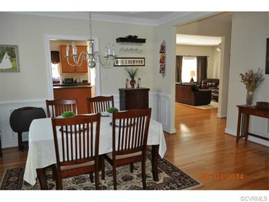 Dining room with chair railing, tray ceiling and c