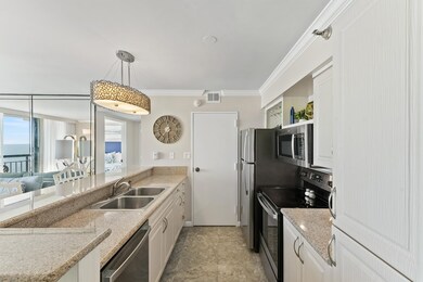 The galley kitchen boasts ample counter space and