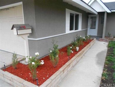 Front house new landscaping, stucco doors and wind