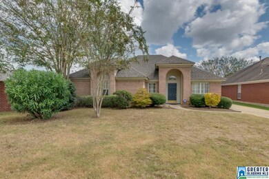 Well maintained landscaping and grand arched entry