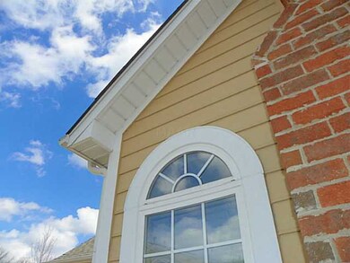 Arched windows on each side of the fireplace... vi