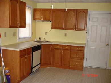 Kitchen. Both units have updated oak kitchens with