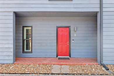 Front entry of condo has covered patio area. All w