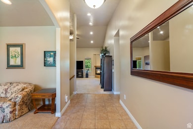 Hall with recessed lighting and light carpet