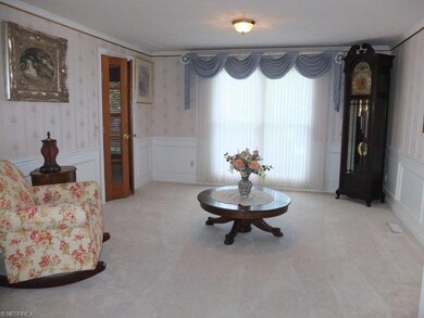 Formal dining room with crown molding.
