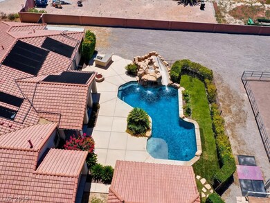 Pool and waterfall, hot tub is under the rocks.  P