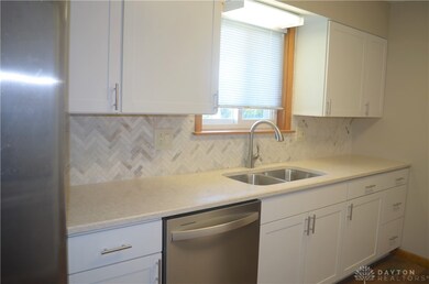 View of kitchen showing window for added light & d