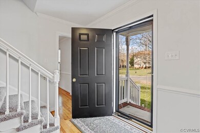 Front foyer has new lighting, hardwood and glass storm door.