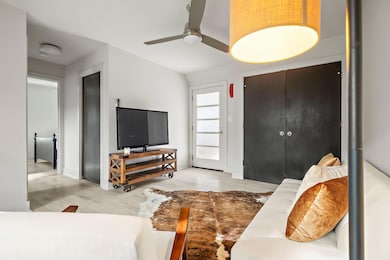Living room featuring ceiling fan