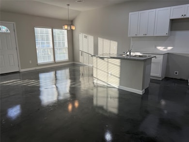 Open concept living, dining, and kitchen